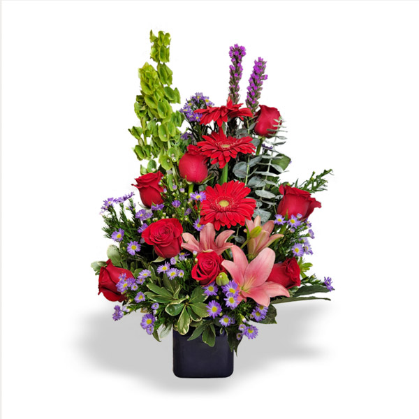 This classic red arrangement will bring a beautiful smile, just as its name suggests