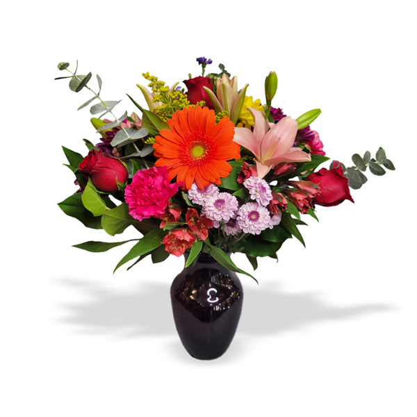 Impress with this elegant, vibrant floral arrangement. Discover it!
