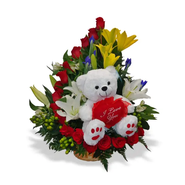 A beautiful arrangement in the shape of a half-heart, featuring a lovely teddy bear in the center of the floral heart, brightens the day with this fine floral arrangement worthy of its name.
